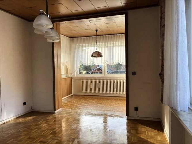 Wohnzimmer mit Wintergarten EG-Wohnung